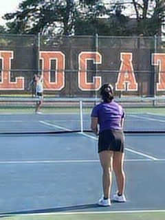 Sophomore Dakota Olsen, number two for singles on the girls’ tennis varsity, serves to the opposing team at the Libertyville High School tennis courts. 