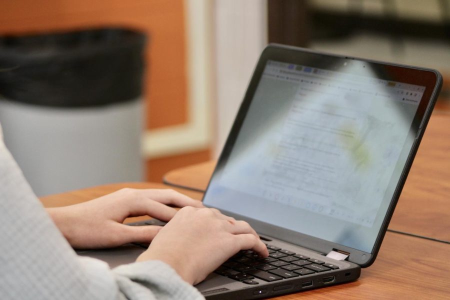 A student takes notes on a chromebook. Studies show that typing is 79% faster than writing by hand.