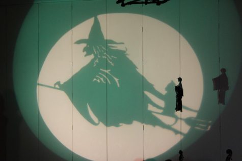 Spooky silhouettes are projected onto the walls in celebration of Halloween, during the 2022 annual “Fright Night” concert.