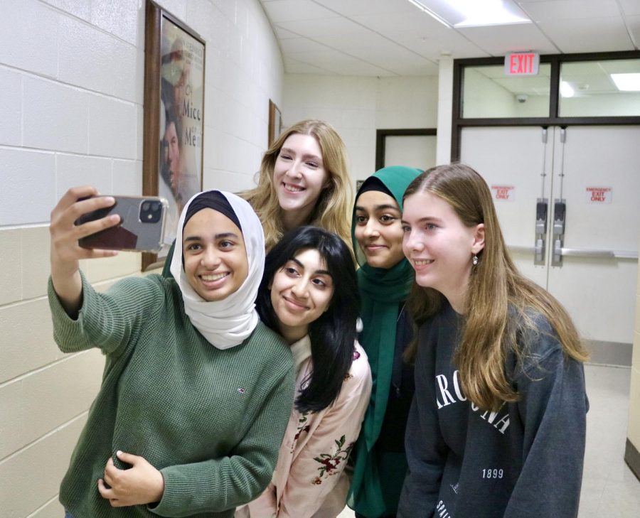 Drops of Ink (DOI) staffers gather for a group selfie to post on social media. 
