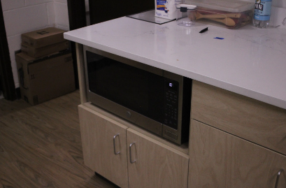 The largest difference between the ADA accessible kitchen and the other five is the placement of the microwave. Placing the microwave in the cabinets makes it accessible to use for students who have difficulty standing or reaching above their head.