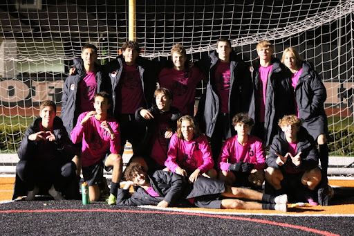 The Libertyville varsity boys soccer team takes a group photo in front of the goal to celebrate a hard-fought last home game of the season.