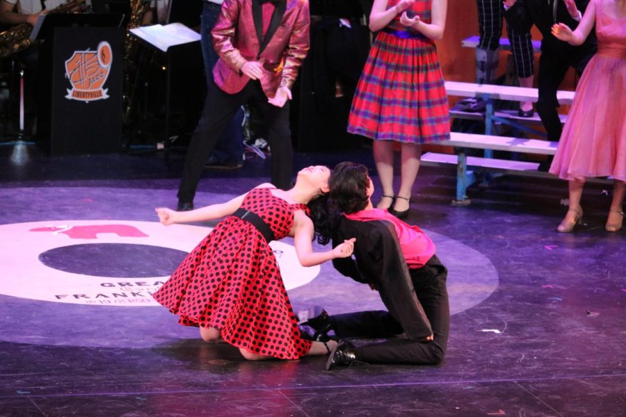 Cha Cha DiGregorio and Danny Zuko, played by Vanessa Zhang and Cris Montero, compete at the Hand Jive contest at the prom to later receive first place.