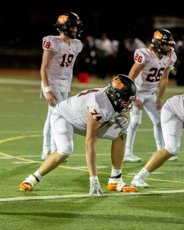 Senior Trenton VanBoening tenses from head to toe in a three-point stance anticipating the next snap. VanBoening is committed to Eastern Michigan University’s football program as an offensive lineman. 