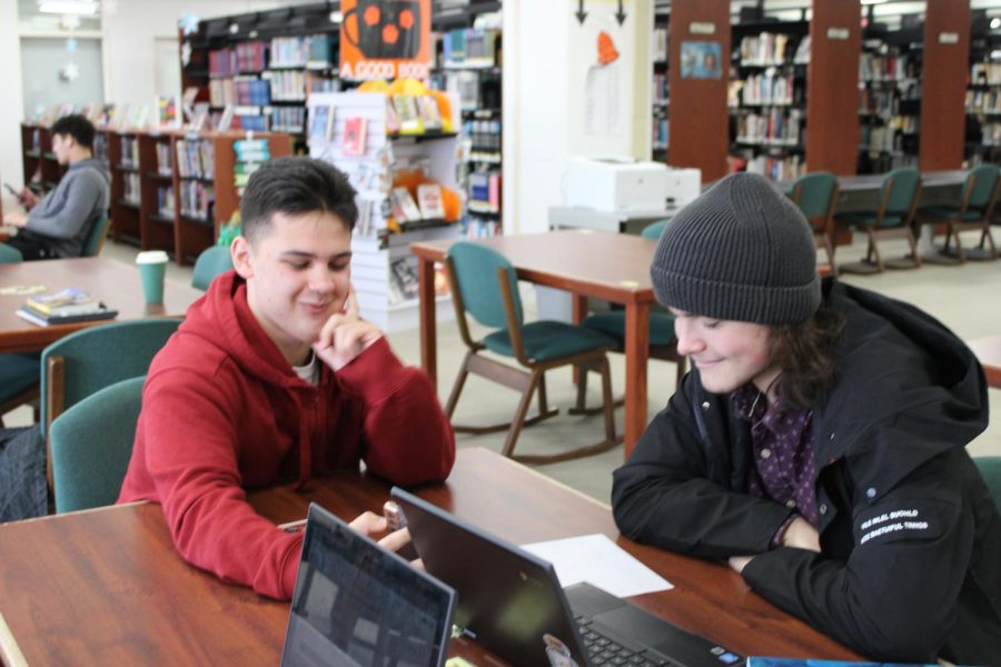 Junior Oleksander Chornopyskyi (left) and senior Daniil Klochkov (right) complete their school work.