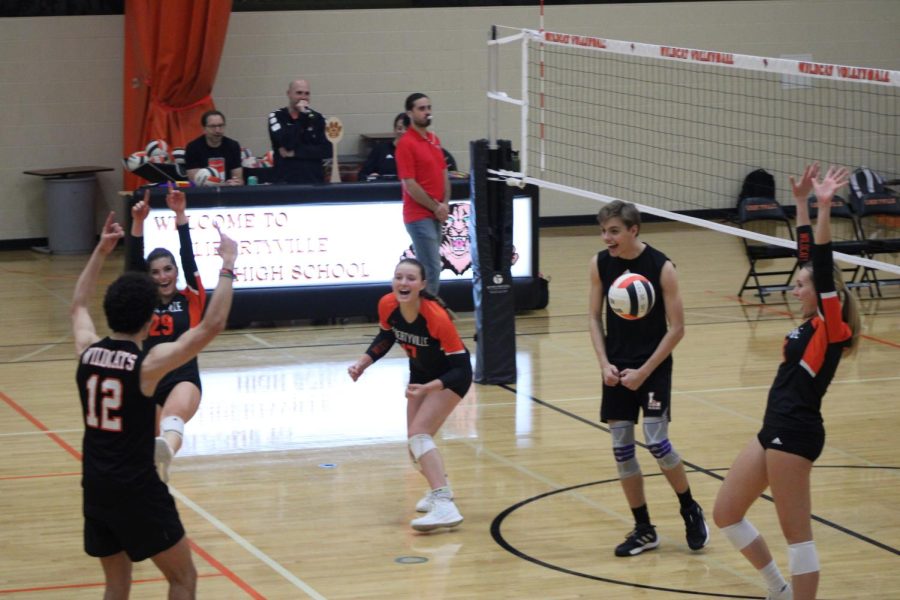 Black team celebrates their victory before facing team Staff.