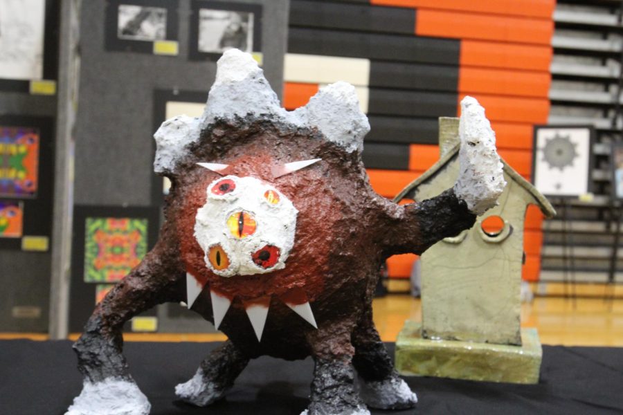 This sculpture titled “Ike Wazowski” was created by Sophomore Jess Levine,who took inspiration from one of her favorite Disney characters “Mike Wazowski”. She created it by molding paper pulp into the shape and then, after drying, painting it and adding finishing details. 
