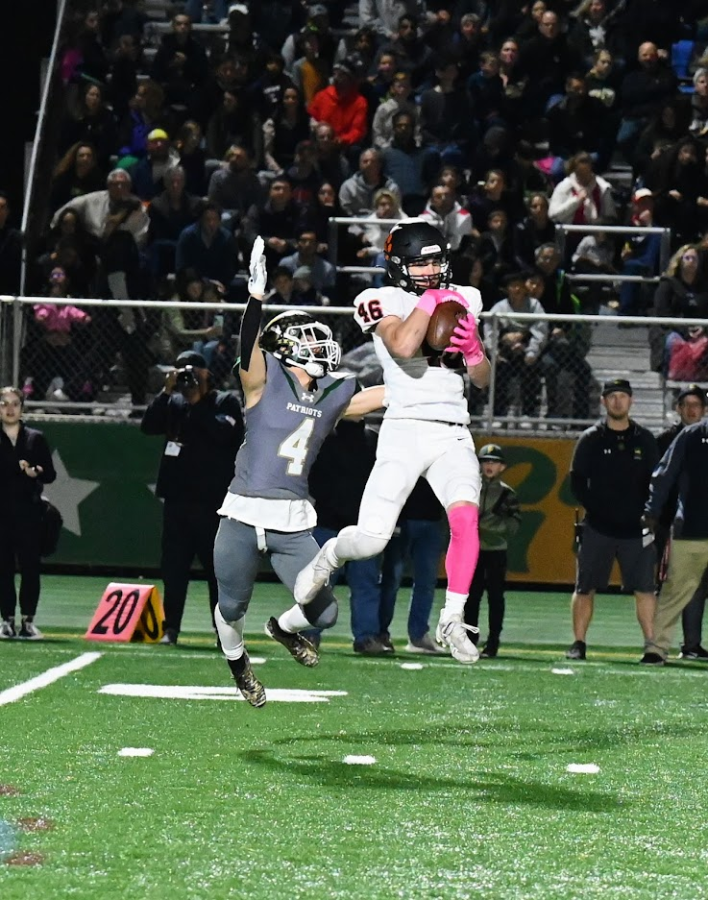 Freshman Blaise Lavista successfully catches a pass to get a 1st down in the varsity game against Stevenson. Photo Courtesy of Coach Mike Jones. 
