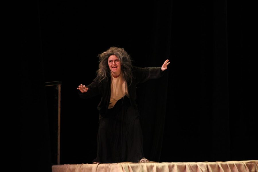 The Strega (Senior Audrey Clemens) taunts the Delle Rose family. 
