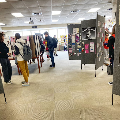 Several students of all grades explore the informative Black History Month museum, which was created by students and staff members to better educate community members during Black History Month.
