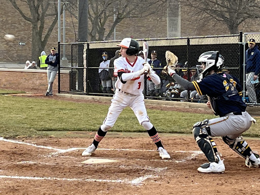 Sophomore Cole Lockwood (1) readies himself for the next pitch from the Glenbrook South Titans during the bottom of the fifth inning in a game on Thursday, March 23, 2023. A strength for the team, Lockwood said, was his speed on the bases. “I would say that once I get on them, I can cause havoc on the field.”