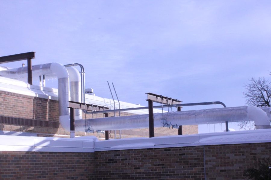 Pipes for heating and cooling run along the roof. The water that comes from the chiller plant goes around the school to a series of fans that blow air across either the hot or cold water pipes to cool and heat the school. All of this water is on a closed loop that the building and grounds team; water does not need to be added unless a part needs changing or something breaks.
