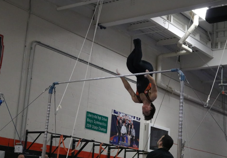 Senior Josh Jenkinson dismounts from the horizontal bar and achieves a 3.60.