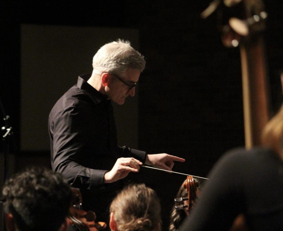 Jeremy Marino, music teacher and orchestra conductor, guides the concert orchestra as they play “Fiddler’s Fury” by Alexander Safford.