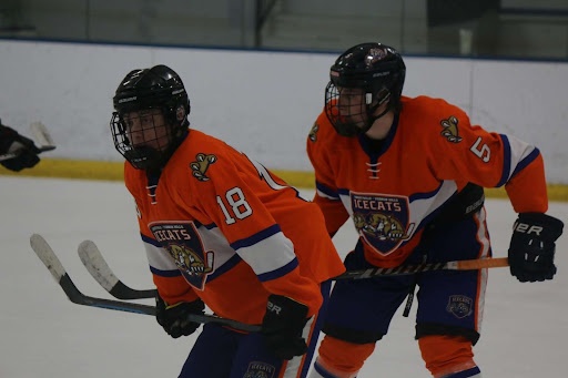 Josh Dobrin and Kyle Born are locking in for a defensive zone faceoff. (photo provided by Joshua Dobrin.)