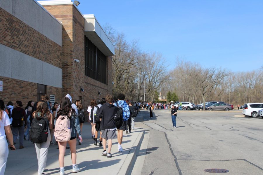 Students process out of the building at 9:30 a.m., gathering in the North Butler parking lot. According to Paige Regan, the goal was to “make a statement against gun violence but also to stand in solidarity with the victims of the school shooting in Nashville.” Local police and Principal Dr. Koulentes supervised the peaceful display protesting gun violence in schools.