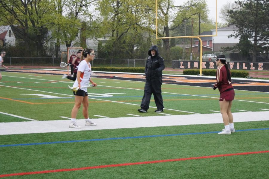 After getting a steal for her team, junior Karah Preisser (15) squares off against a Saxon, determined to get her team to the goal.