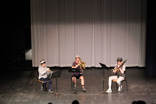 A brass trio, composed of seniors Nicholas Ingino (left), Mason Neilson and Jack Shaw, showcase their musical skill set by playing two different pieces.