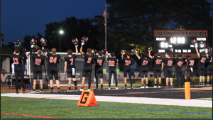 Prior to a game against the Richards Bulldogs from Oak Lawn, the varsity football team stands tall and proud prior to the game. The dedication and spirit brought by the team enabled them a win over their opponents, with a final score of 34-14.