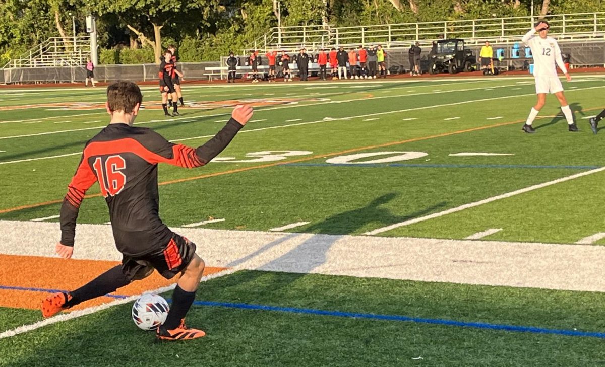 Sophomore Jackson Kern (16), a winger for the team, prepares to send the ball inbounds towards his teammates. “I thought we did a really good job connecting through the middle and switching the field today,” Kern said.