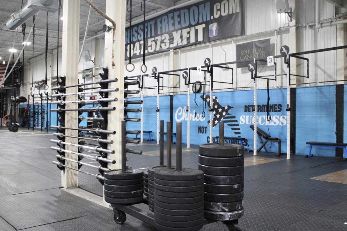 Pull up bars and weight benches align Crossfit Freedoms vibrant blue walls, as do words of motivation. Open six days a week, Crossfit Freedom currently has a variety of trainers and four main coaches that help athletes with conditioning and total body strength training. 