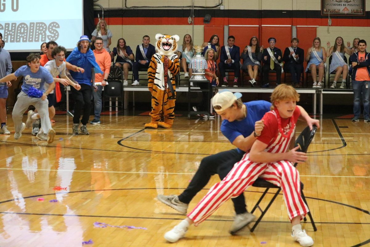 Sophomore Trevor Wallace wins musical chairs after tough competition from senior Mason Marabella. Wallace was cheered on by the sophomore section during the competition.
