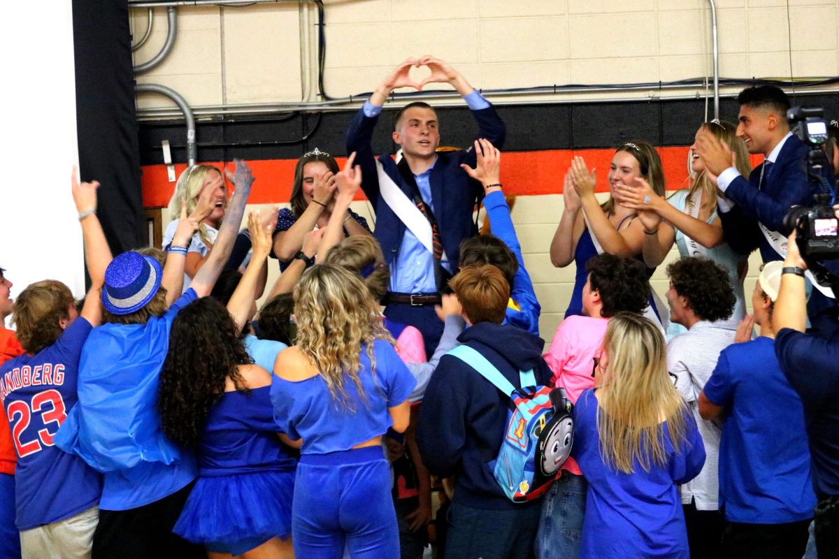 Senior Henry Calsin wins Homecoming Wildcat and thanks the student body for his victory as his classmates rush to celebrate with him.