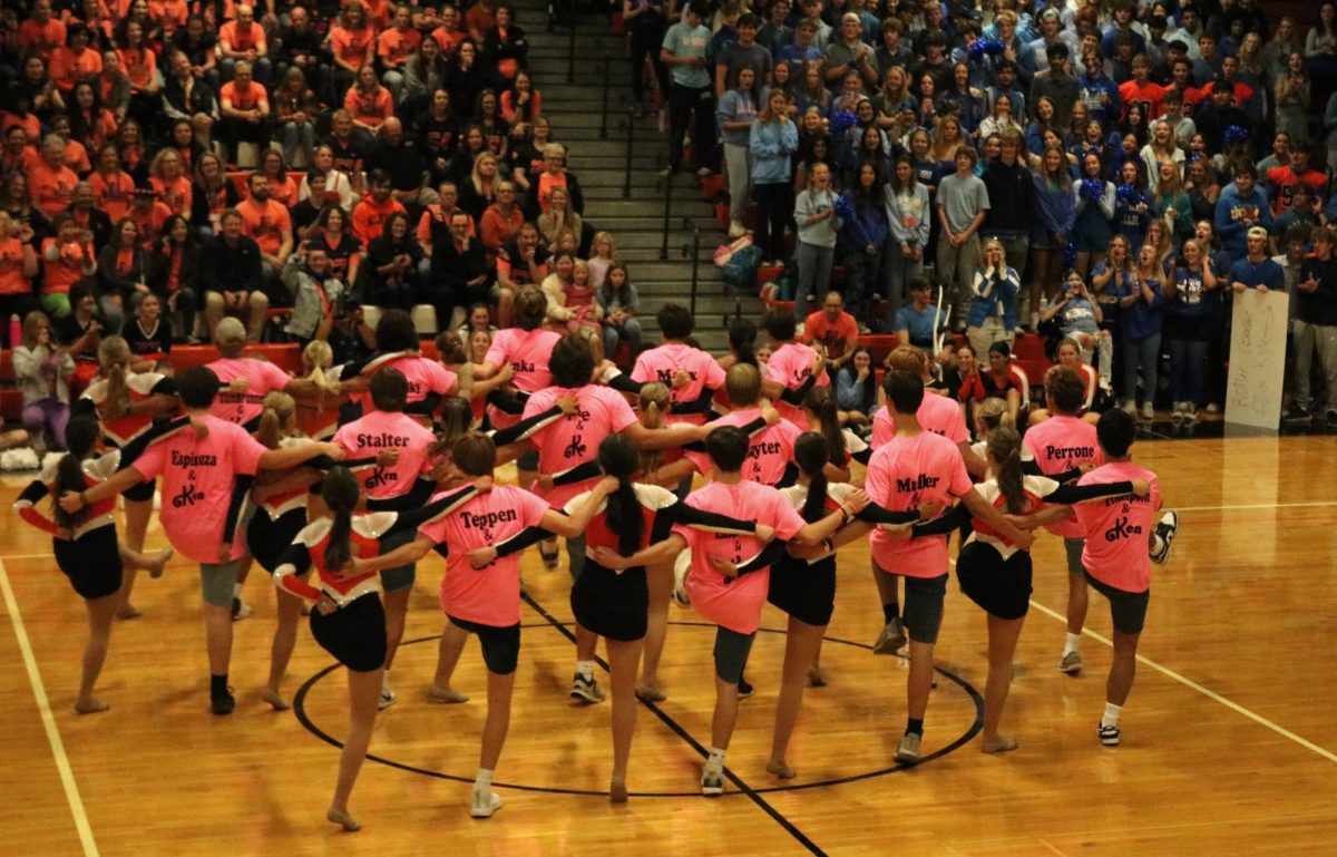 The Poms team performs a fun dance routine with some of the varsity football players. The dancers showcased their skills while keeping it simple as they performed to popular songs.