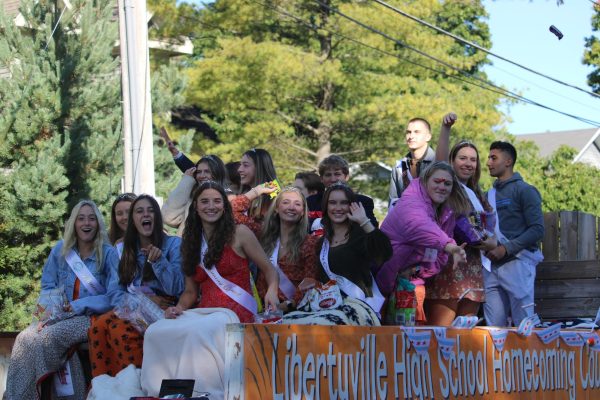 Welcome your 2023 Homecoming Court! This senior-nominated group of students were selected by their teachers and peers for demonstrating the DARING mission, waved and cheered as they rode past Libertyville residents.