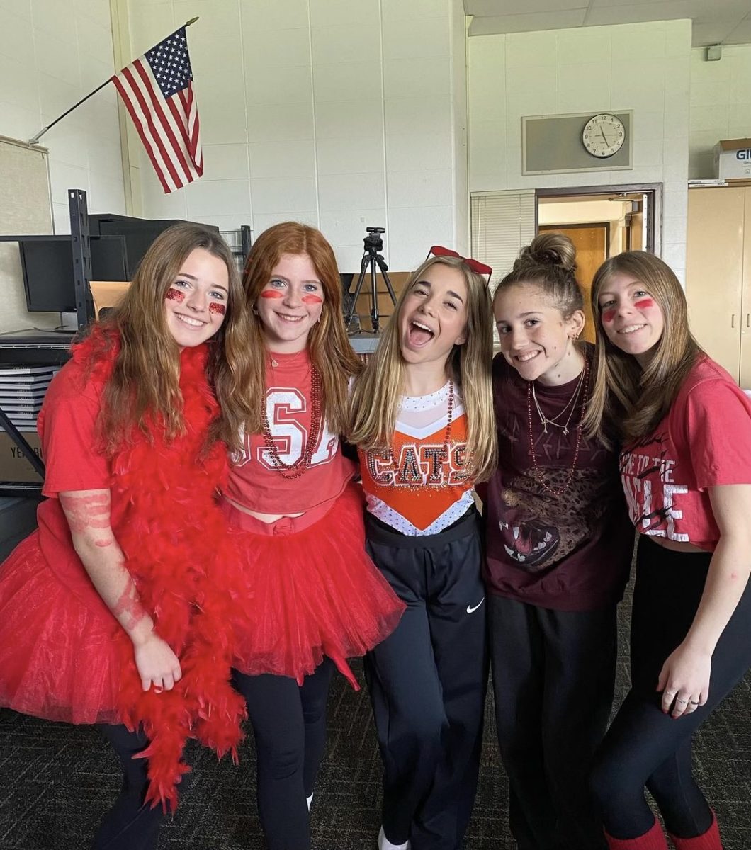 On+Oct.+22%2C+2022%2C+sophomore+yearbook+staff+members+dress+in+red+for+the+color+wars+assembly+to+celebrate+homecoming.+%28Taken+by+Yearbook%29