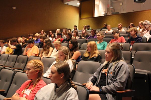 Seniors Sarah Harvey (center left) and Lily Flader (center right), members of the cross country team, attend Wildcat’s Will in the studio theater to focus on overcoming mental blocks and self doubt.