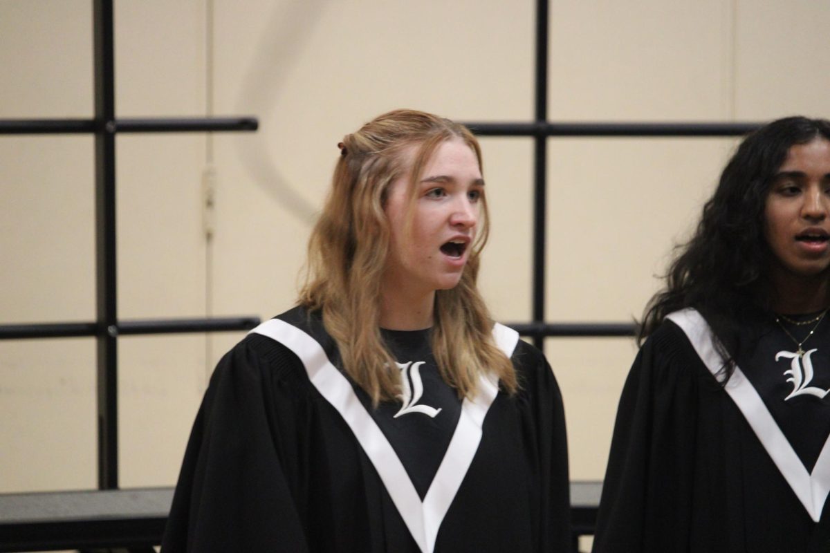 Junior Delaney Rybicki performs a solo during the song “What Happens When A Woman” by Alexandra Olsavsky. Olsavsky, a soprano singer hailing from Chicago, created this song with strong vocals and an impactful message.