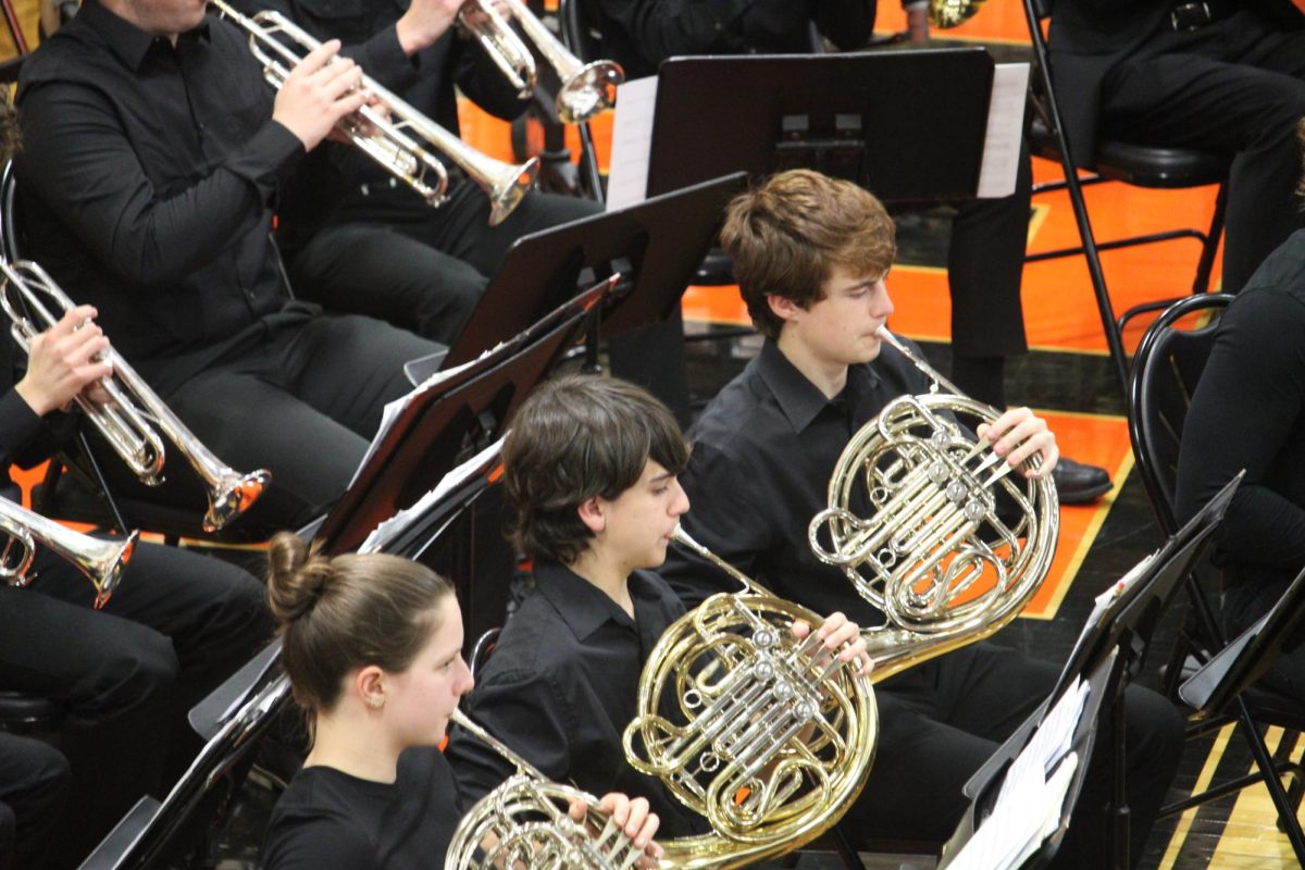 Sophomore Billy Sims, a French horn player in Symphonic Winds, performs at the band festival. Sims has been a part of the band festival since his time as an Oak Grover. “I love getting together with the middle schoolers and playing pieces and we sound great this year,” Sims said. 
