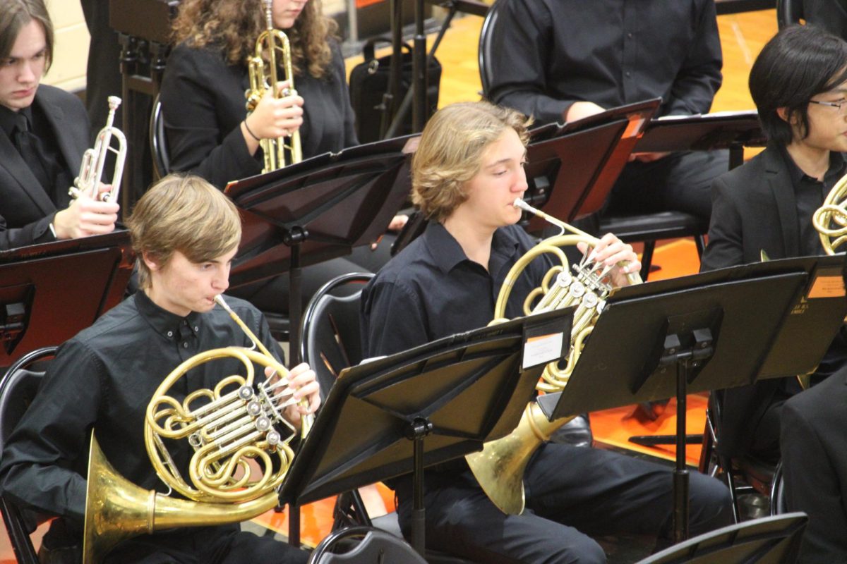 Senior Wil Kozlowski, a French horn player in the Wind Ensemble, performs in his final band festival concert. Kozlowski reflected on his time in the LHS Band program.“I feel like there’s been a lot of growth from my start in Concert Band all the way up to the Wind Ensemble both in my own skills, my peers skills and that the songs have been progressively challenging,” he said. While Kozlowksi doesnt plan to major in music in college, he hopes to take part in musical ensembles. 