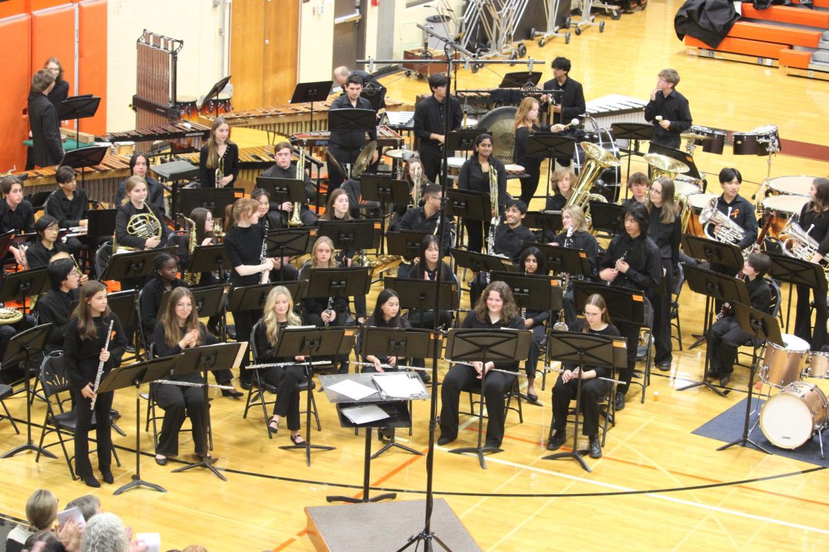 Students stand as they are recognized for selection in the ILMEA District 7 band. LHS has a large number of highly skilled students performing in the all district band which picks a certain number of students from hundreds of auditioners. This year, Dakota Olson, Kyle Li, Breanna Dunworth, Jessica Hedlund, Annika Brody, Margo McGormley, Aditi Nair, Annabelle Gohr, Cameron Huang, John Nelson and Matthew Reichard were all selected and were recognized for their accomplishment during the concert. 