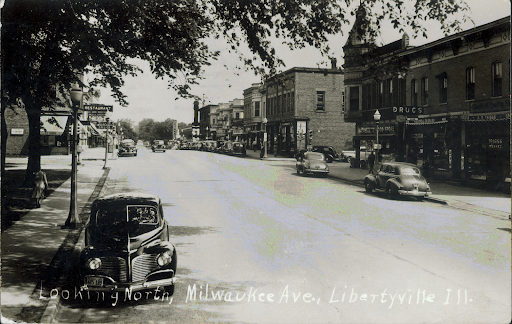 The Village of Libertyville was first established under the name Vardin’s Grove in 1837. As more people settled, new commerce emerged, the area changed, and the village was renamed Libertyville in 1841. This community has been the backdrop for bustling business, a home to nationally known celebrities and politicians and holds deep roots for Illinois history. Here is a selection of photos from the Libertyville Historical Society dating back to as far as 1890 and what those locations look like today. 
