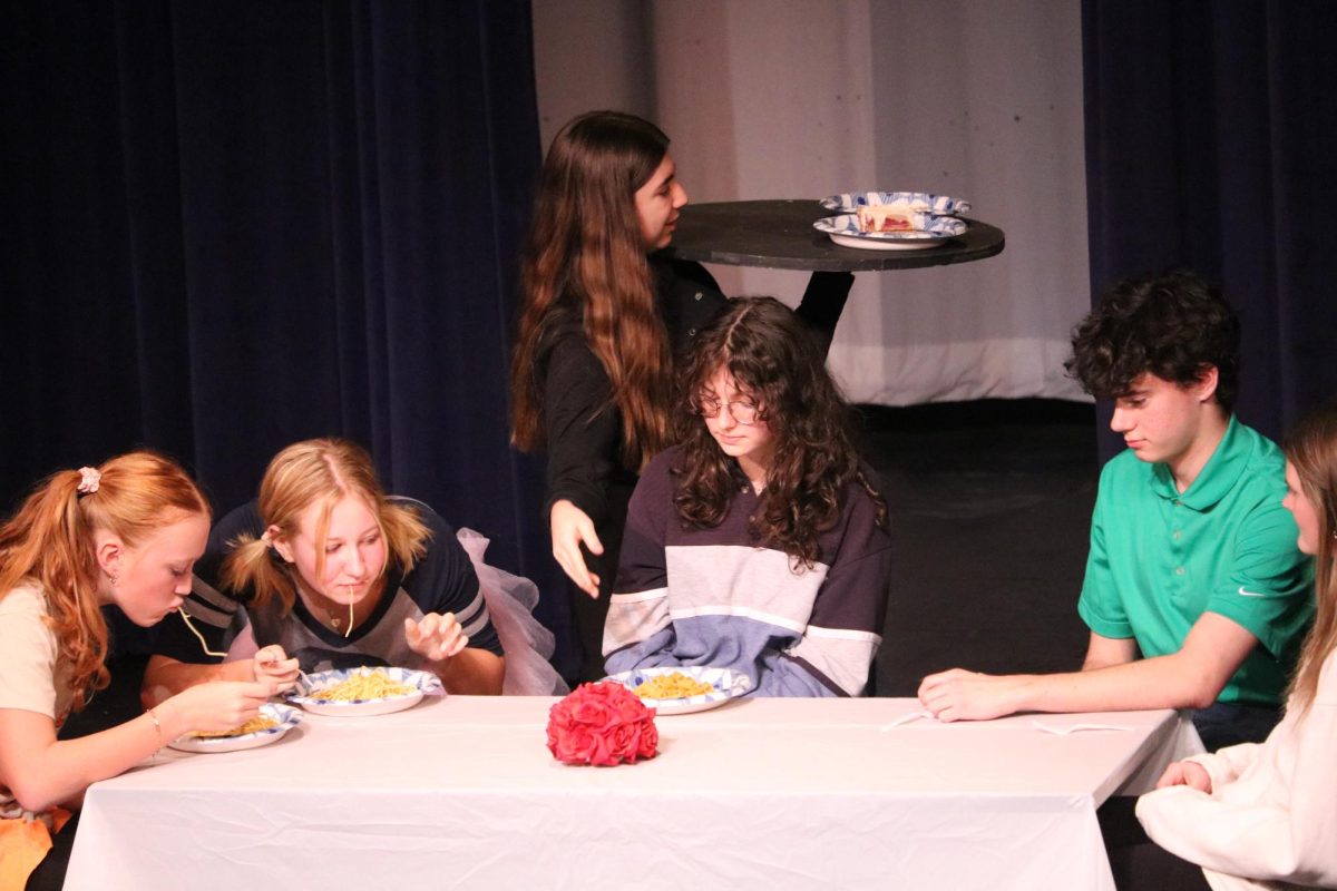 Junior Lauren Podlogar, who played Debbie, celebrates her birthday with her family at Olive Garden. Adapted from the iconic SNL skit, Debbie finds a way to ruin the moment with her depressing fun facts – even on her own special day. 