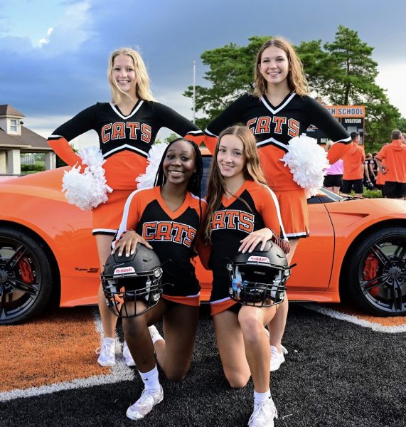 It’s clear that with many high schools, sports bring the community

together. The same can be said for LHS. Showcased at various sporting
events and assemblies, juniors Morgan Short, Francesca Crovetti, and
sophomores Kailynn Kilpatrick and Olivia Vanheirseele, are apart of the
LHS cheer team and have a great presence year round.