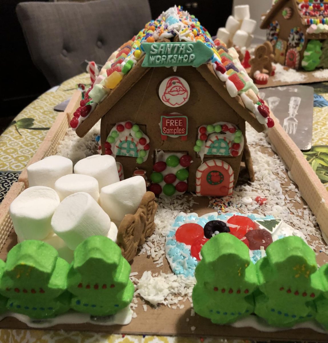 In 2018, our houses were more simple, but still creative and colorful. One of the house’s roofs was decorated with candies like gumdrops, sprinkles and Skittles. The Christmas Tree Peeps was a nice addition to the front of the house and are a great candy to use around a gingerbread house. 