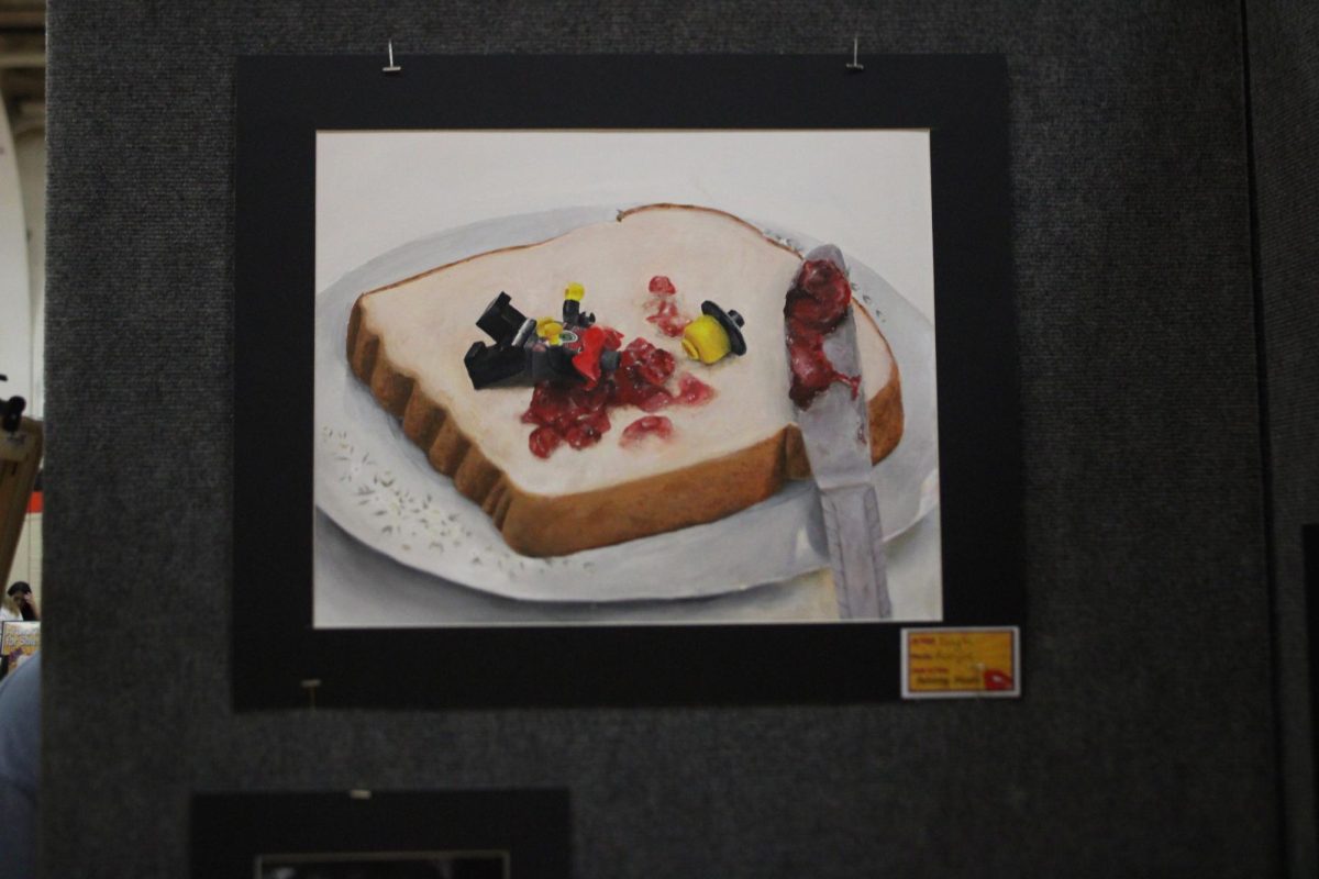 Various students display their artwork at the pop-up art show including paintings in different mediums such as acrylic and oil paints on canvas board and hand-stretched canvases, drawings, digital art, and photography.  