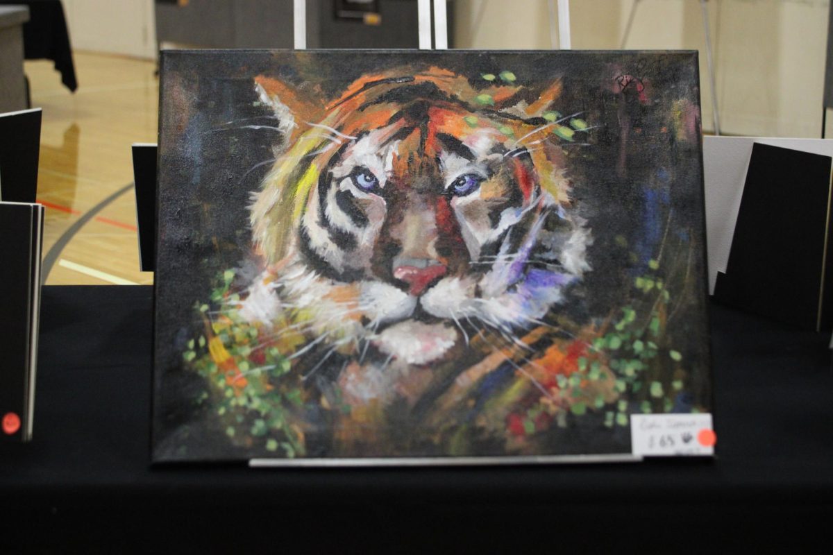 Junior Rishi Tipparti sold a painting for $65 during the art show. Other students and teachers also put up various artwork, such as prints and jewelry, for sale.  