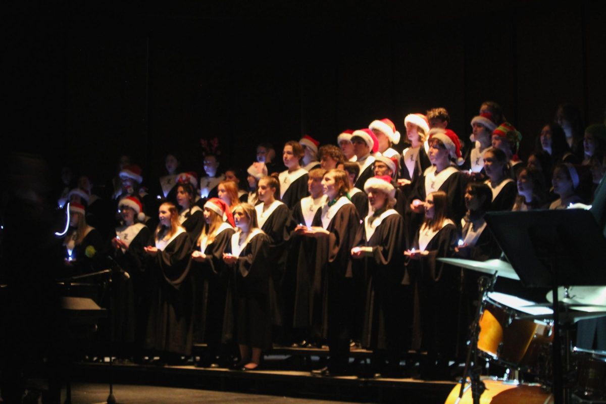 The Holiday Festival Choir begins the concert by entering the auditorium and singing “Riu Riu Chiu” by Audrey Snyder, lighting up the way with LED candles. “It was a really bittersweet experience, being my last holiday concert,” senior Charlie Tomlinson said. “I was super happy to have made it to the beginning of the end.”
