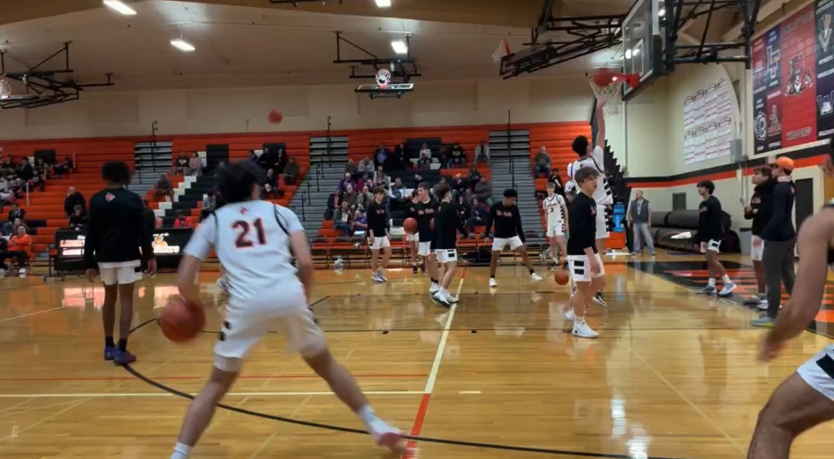 Boys basketball battles Rolling Meadows in a close game to the finish