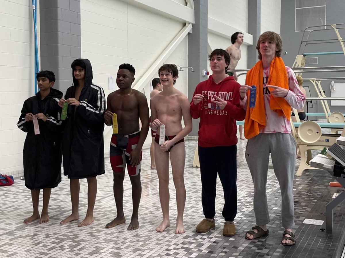 At the end of the sixth round, senior Charlie Watson (right) receives first place and senior Jake Gimbert (left of Watson) receives second place for JV. Both athletes are also varsity lacrosse players, while Gimbert does football as well.