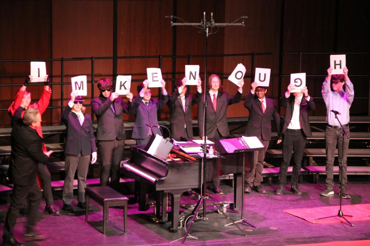 (From left to right) Freshmen Dustin Lang, Nathan Likosar, sophomores Nick Taylor, Wisam Shaaya, juniors River Thompson, Jake Potter, freshmen Akshay Jaladi, Isaac Stone and senior Jack Birmingham – all part of Cleftomaniacs, the all-male choir – perform “I’m Just Ken” from “Barbie.” Caption by Ash Magalhaes