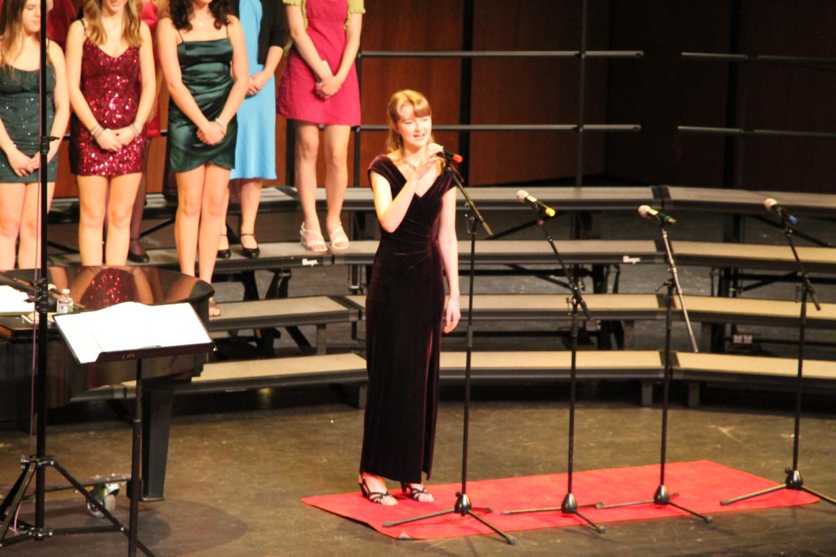 Sophomore soloist Liza Allen performs her first solo at LHS, “Start a Fire” from “La La Land.” To prepare, Allen said she “warmed up and sang a little bit in the car.” Captions by Ash Magalhaes