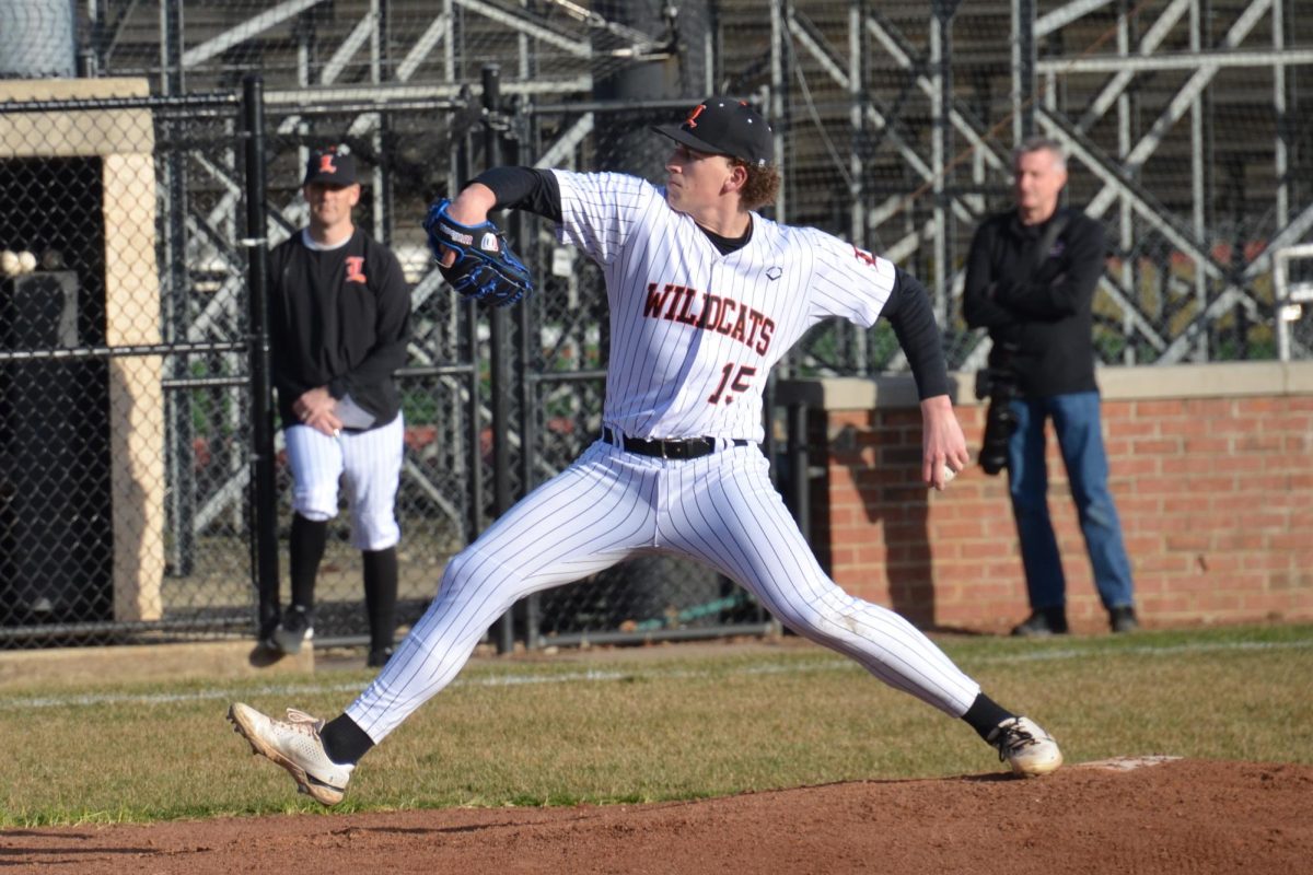 Junior Josh Holst (15), who recently committed to play baseball at the Air Force Academy, pitches on the mound during the game against Crystal Lake Central. Holst, also a football player, pitched most of the game for the Wildcats.