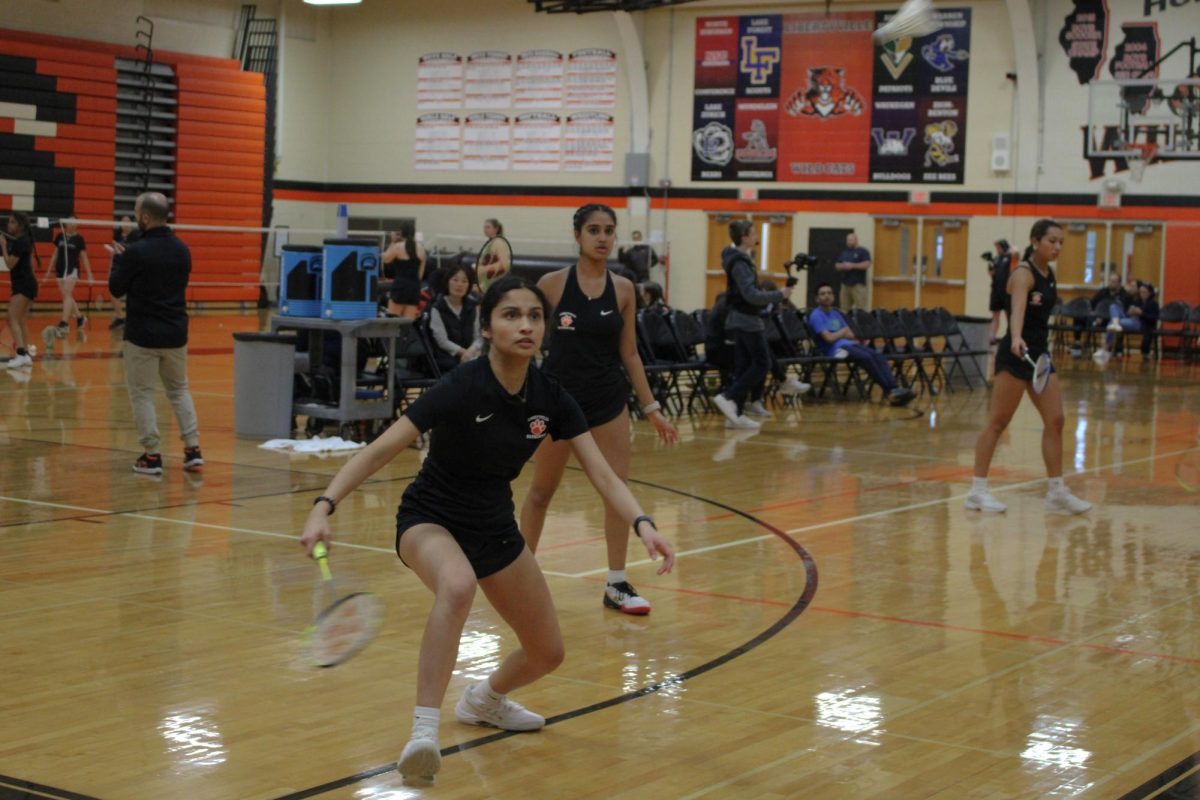 Sophomores Roohee Patil and Nicole Mathews fight for their win against Glenbrook North’s Sydney Jon and Kayla Yoon, as Mathews lunges forward during their second game to secure the win. “They were close matches,” Patil said. “[We] have really good chemistry.”
