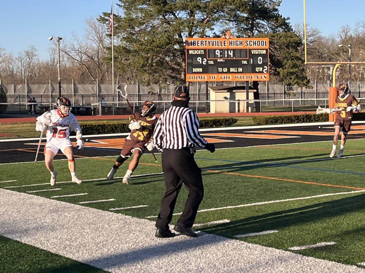 Senior attackman Tommy Gonnella (15) takes the ball along the outskirts of the field during the second quarter. Gonnella was one of three players with hat tricks against the visiting Corsairs, alongside sophomore Niko Messina (33) and senior Kyle Carollo (4).