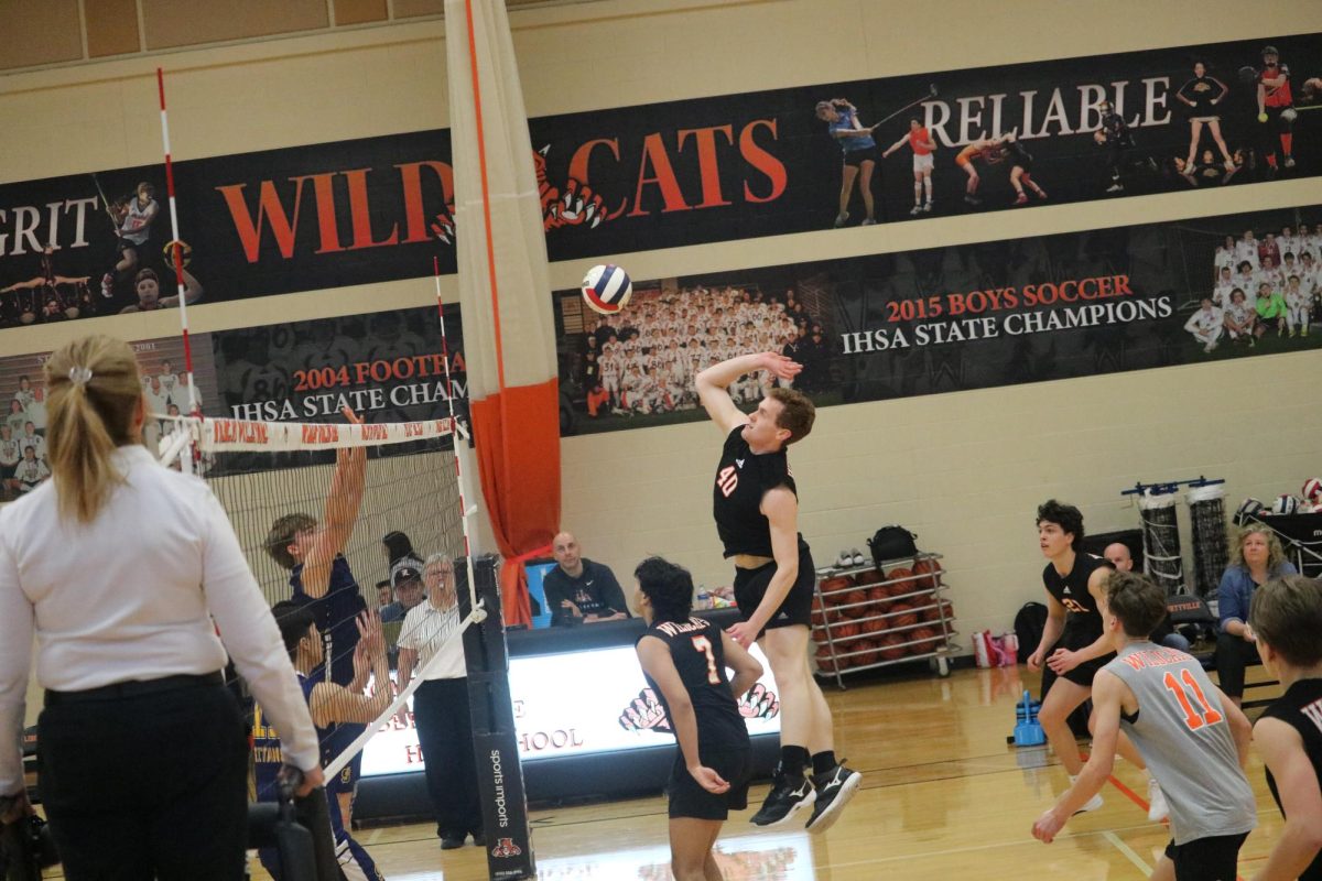 Junior middle blocker Jordan Coughlin (40) goes up for a hit. Coughlin had 3 kills in the game against the Titans.
